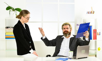 Successful business. Business couple working. Couple in office. Distribute obligations and organize...