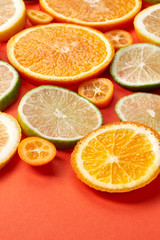 Naklejka na ściany i meble Selection of citrus slices on paper background 3