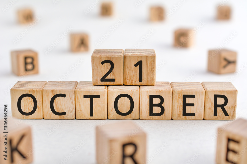 Poster october 21 - from wooden blocks with letters, important date concept, white background random letter