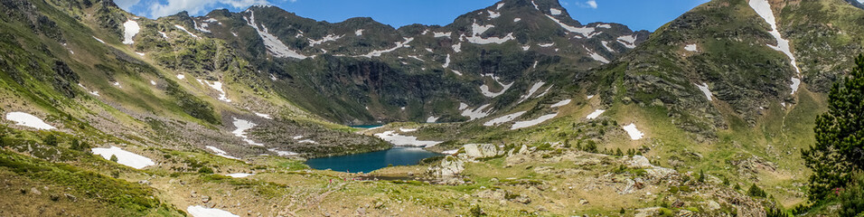 Fototapeta na wymiar Tristaina high mountain lakes in Pyrenees, Andorra.