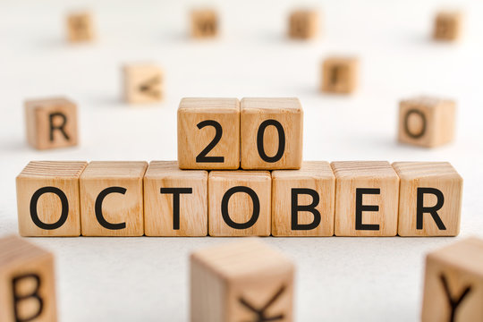 October 20 - from wooden blocks with letters, important date concept, white background random letters around