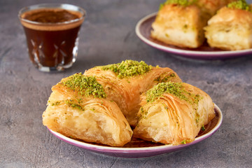 Sweets arabic dessert kunefe, kunafa, knafeh with pistachio and cheese