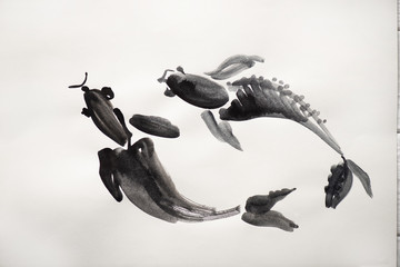 Top view of paper with japanese painting with fishes on white background © LIGHTFIELD STUDIOS