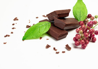 Pieces of chocolate on white background