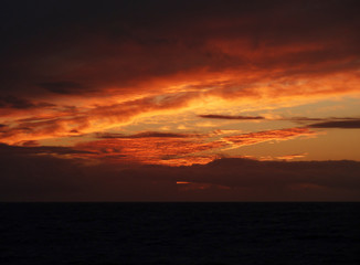 Antarctica landscape with the ocean in the sunset