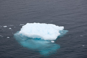 Antarctic. Bizarre icebergs on a clear sunny day