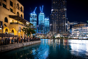 Crowded Dubai mall fountain show area full with tourists and visitors