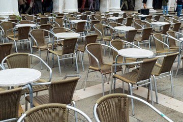 Fototapeta na wymiar Abstract rhythm of terrace tables and chairs