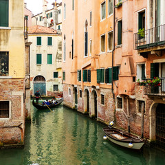 Fototapeta na wymiar City scenery with gondola in Venice, Italy