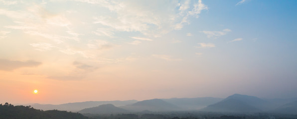 Fototapeta na wymiar Sunset scene with silhouette mountain at Khun Dan Prakan Chon Dam