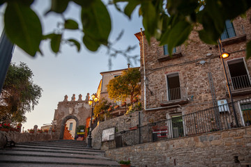 Old door and staircase of the city of Agropoli in Cilento, Campania, Italy.