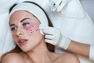 Skincare Face Treatment. Anti Aging Injection Beauty Procedure In Cosmetic Clinic For Female. Beautician Hands In Gloves With Syringe.