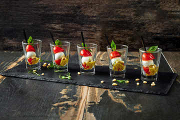 Caprese salad in a row - skewer with tomato, mozzarella and basil, italian food and healthy...