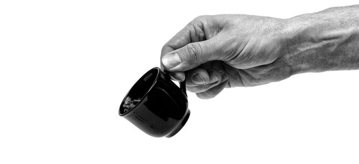 Male hand holding coffee cup isolated on white background. Minimalistic concept.