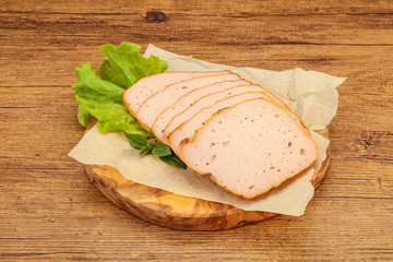 Boiled pork sausage over board