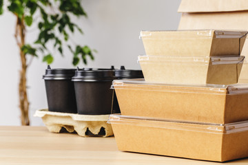 Assortment of various food delivery containers on table close up