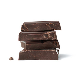 stack of pieces of black chocolate isolated on a white background