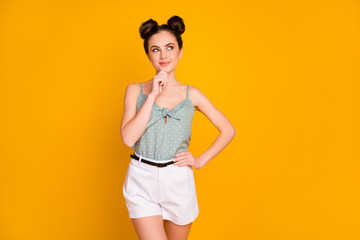 Portrait of positive interested girl touch hands chin think thoughts plan her weekend free time wear singlet isolated over bright shine color background