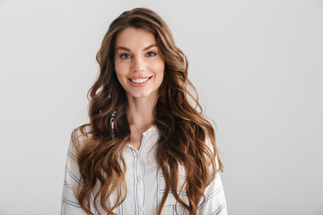 Image of joyful caucasian woman smiling and looking at camera