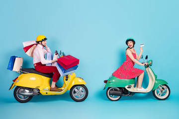 Full size profile photo of crazy shopaholic lady giving credit card assistant guy drive retro moped...