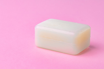 Soap bar isolated on pink background.