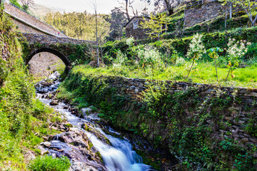 bridge over the stream in the mountains