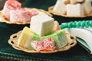 Close up of a little oriental plate with turkish delights sweets