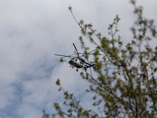 Police helicopter in the sky over parks