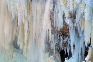 Winter landscape of frozen Upper Tahquamenon Falls, Tahquamenon Falls State Park, Michigan's Upper...