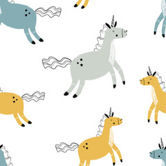 Fototapeta premium Vector hand-drawn colored childish seamless repeating simple flat pattern with unicorns in Scandinavian style on a white background. Cute baby animals. Pattern for kids with unicorns. Magic. 