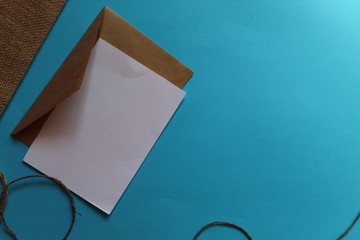 craft, brown envelopes lie on a blue background. write an email.