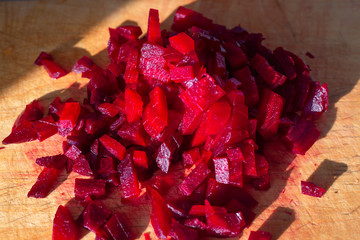boiled beets diced for salad on a wooden board, vitamin vegetable