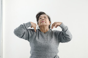 Asian senior woman doing exercise and dancing at home, stay home lifestyle concept.