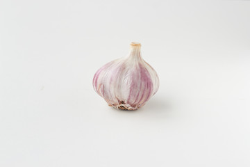 whole head of garlic on a white background