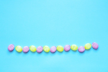 Obraz premium Multicolored candys on a colored background