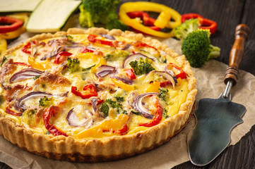 Homemade quiche with vegetables and cheese, vegetarian food.