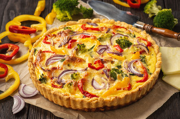 Homemade quiche with vegetables and cheese, vegetarian food.
