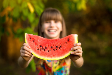 Funny portrait of incredibly beautiful little girl eating watermelon, healthy fruit snack