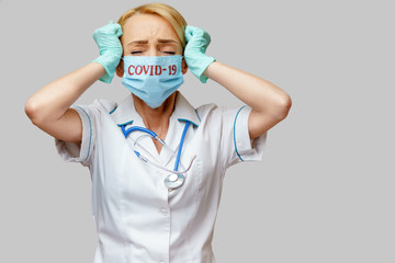 medical doctor nurse woman wearing protective mask and rubber or latex gloves - headache and stress