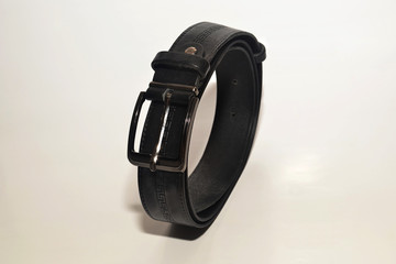 Black trouser belt on a white background isolate