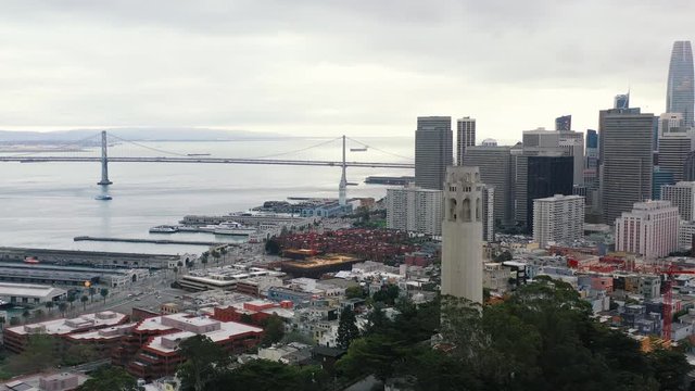 Aerial view of San Francisco cityscape with skyscrapers, ocean and mountains