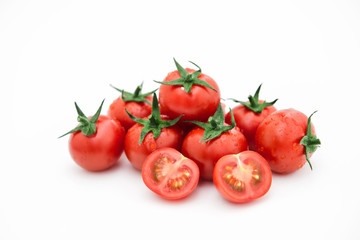 Closeup of tomato white on white background.  Healthy vegan food. Tomato top view. White background. Studio shot. Cherry isolated. Healthy vegetarian food. Cherry set.