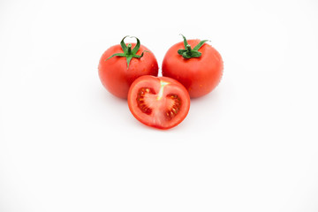Closeup of tomato white on white background.  Healthy vegan food. Tomato top view. White background. Studio shot. Cherry isolated. Healthy vegetarian food. Cherry set.