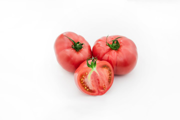 Closeup of tomato white on white background.  Healthy vegan food. Tomato top view. White background. Studio shot. Cherry isolated. Healthy vegetarian food. Cherry set.