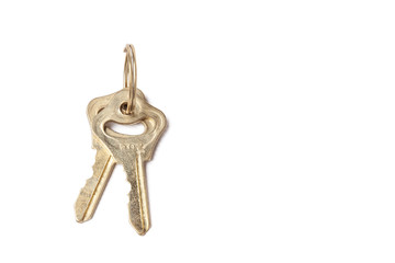 Two metal old keys with extruded symbols and a blade on a ring on a white isolated background. New...