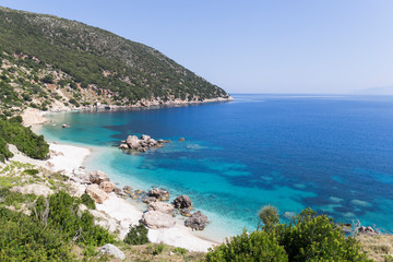 Fototapeta na wymiar Beach on the island of Kefalonia, Greece. Most beautiful wild rocky beaches with clear turquoise water and high white cliffs