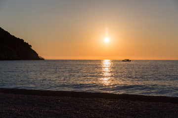 Naklejka premium sunset at Myrtos beach, kefalonia island in Greece