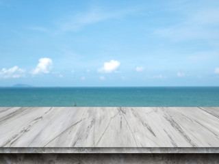 Empty concrete table top on sea and sky blurred background.