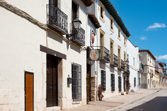 Chinchon, comarca de Las Vegas, Spain - A street in the traditional village of Chinchon outside Madrid with Spanish architecture.