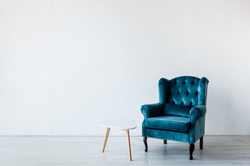 comfortable armchair near coffee table in living room